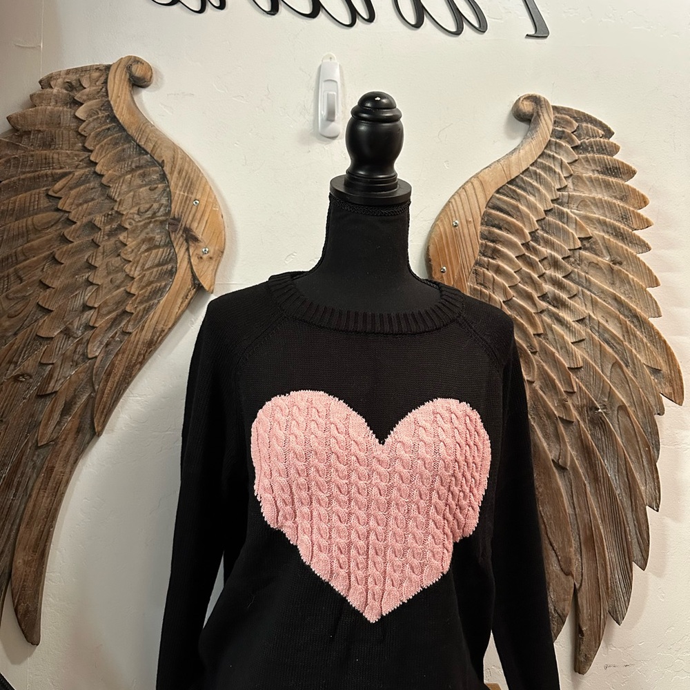 Black sweater with pink heart